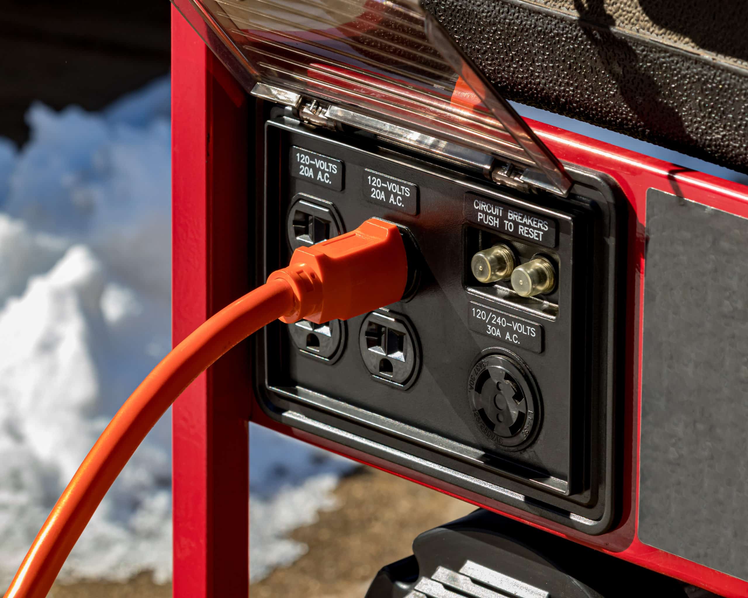 Portable emergency power generator with electrical cord.
