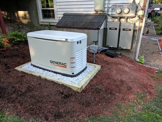 Generac whole home generator installed outside home in Massachusetts