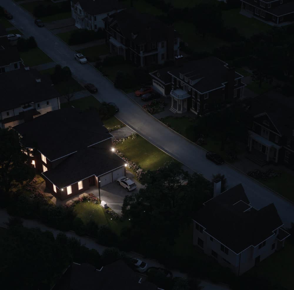 single home with lights on in neighborhood black out