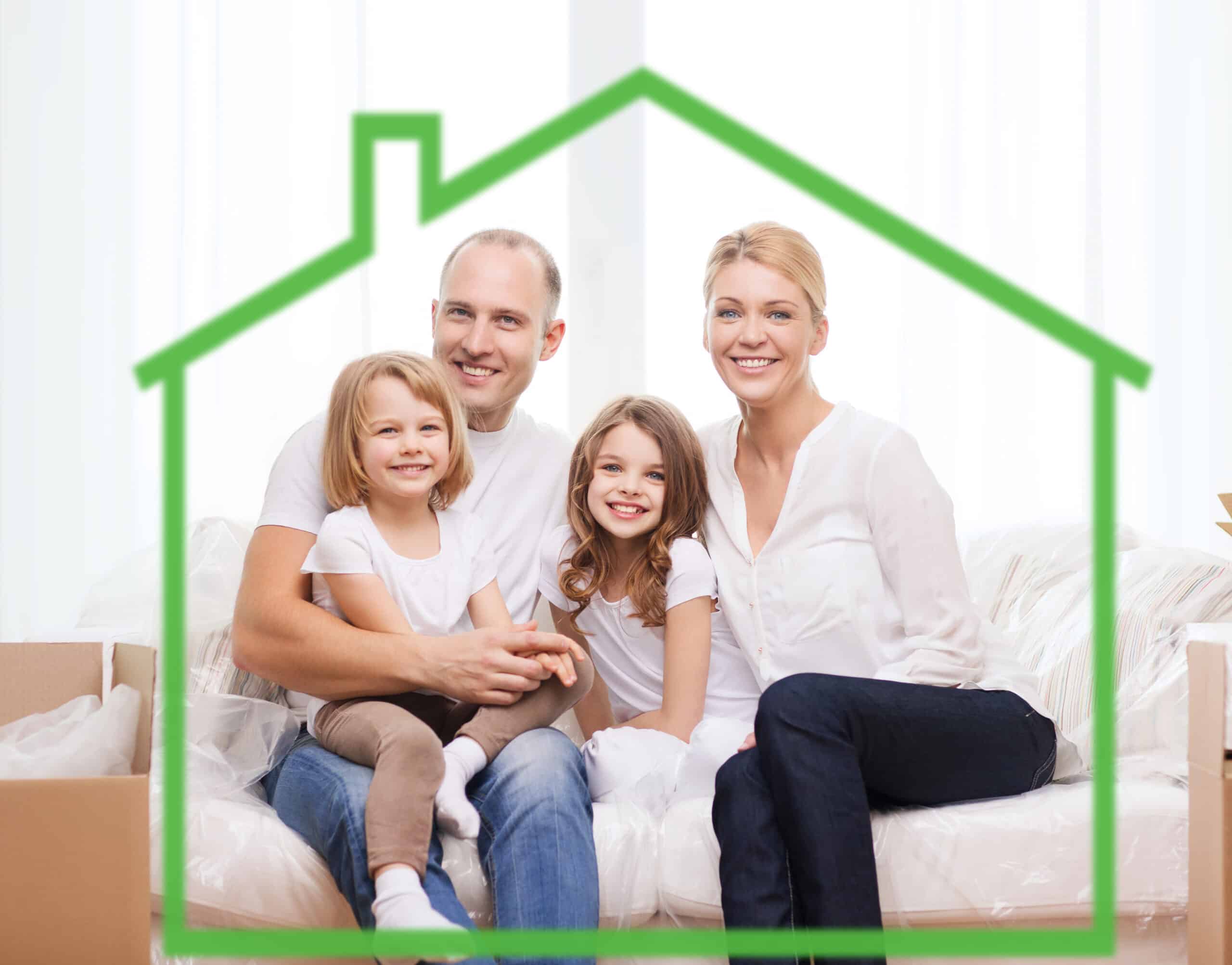 family, children, accommodation and home concept - smiling parents and two little girls at home behind green house symbol